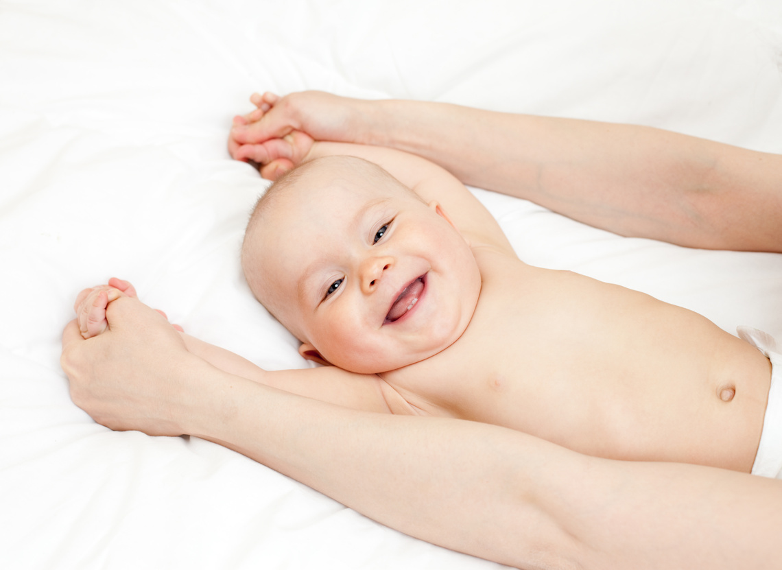 Baby Massage by Parent on Bed